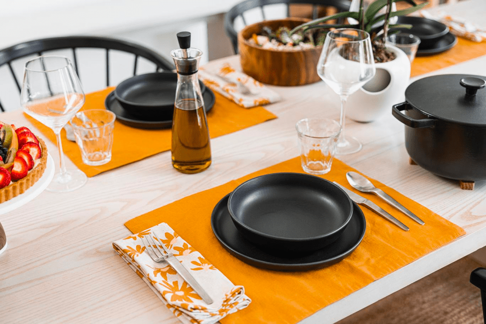 Stoneware dinner plates on a wood table